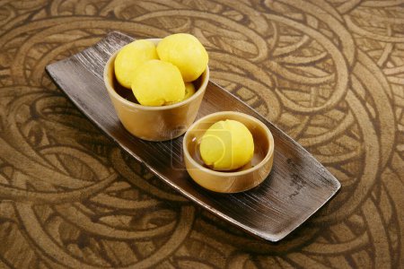 Photo for Rajbhog or Yellow Bengali Rasgulla or Cham Cham - Indian Sweet - Royalty Free Image