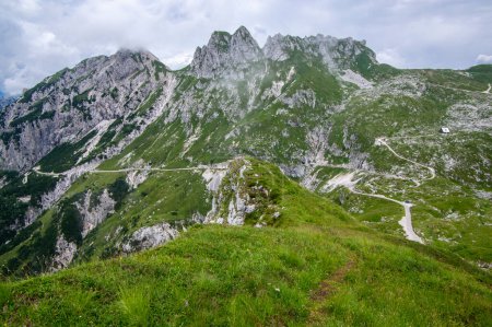 Téléchargez les photos : Mala Spice Cime Verdi peaks on Mangart saddle, Slovenia's Highest Panoramic Road, heavy clouds before summer rain - en image libre de droit