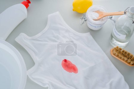 Photo for Dirty blood stains or wine on clothes. The concept of organic removing stains on clothes with baking soda. Zero waste concept. top view. High quality photo - Royalty Free Image