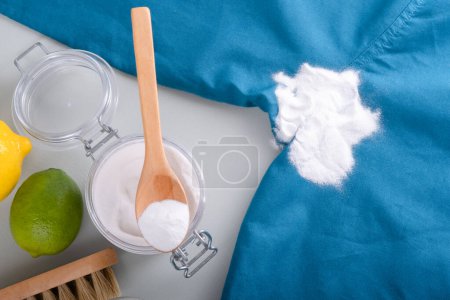 Homemade cleaning sweat stains the armpits on a T-shirt. Eco-friendly cleaning products white vinegar, baking soda, lemon. Embracing a zero-waste lifestyle. High quality photo