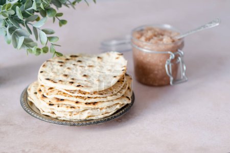 Hands holding heart-shaped matzah. Healthy food. Jewish Passover celebrations concept. High quality photo