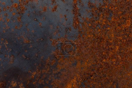 Photo for Background. The texture of the old rusty metal plate with cracks - Royalty Free Image