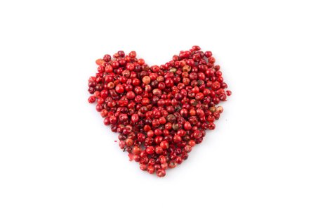 Photo for Red peppercorns seeds isolated on white background - hart shape - Royalty Free Image