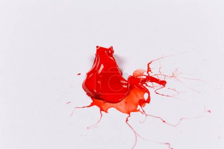 Red stroke splash of the paint brush on white paper