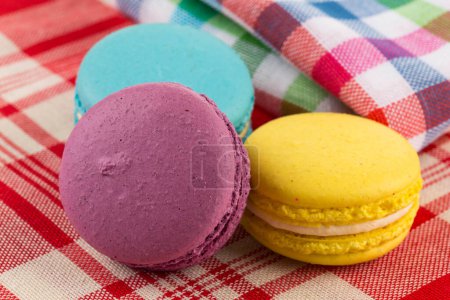 Photo for Colorful few macaroons on tablecloth fabrick close up - Royalty Free Image