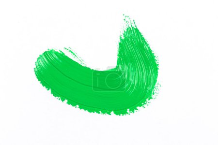 Green texture splash stroke of the paint brush on white paper background