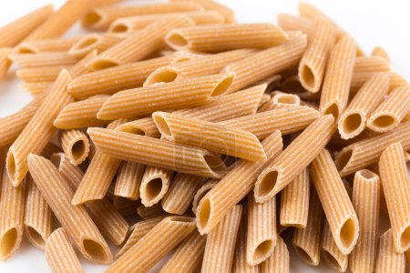 Photo for Wholemeal Pasta Penne as close-up shot isolated on white background - Royalty Free Image