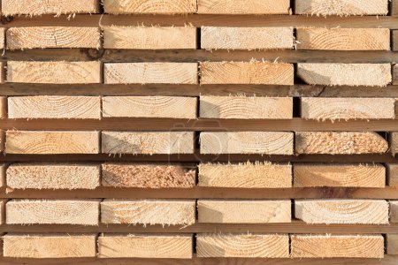 Photo for Stack of new wooden studs at the lumber yard - Royalty Free Image