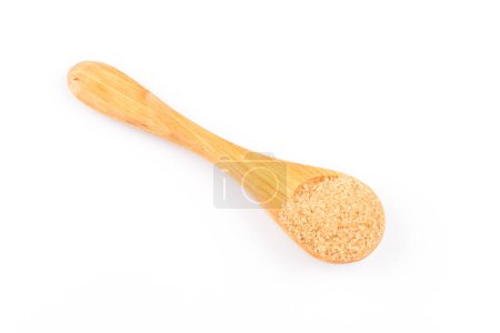 Photo for Brown sugar in a wooden spoon on white background - Royalty Free Image