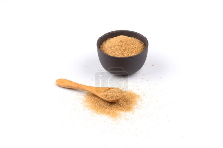Photo for Brown sugar in a wooden spoon on white background - Royalty Free Image
