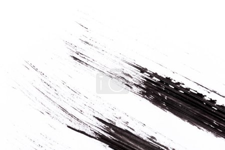 Foto de Pintura negra aislada sobre papel blanco - Imagen libre de derechos