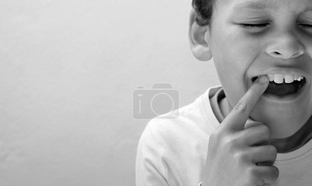 Photo for Little boy with toothache in pain on white background - Royalty Free Image