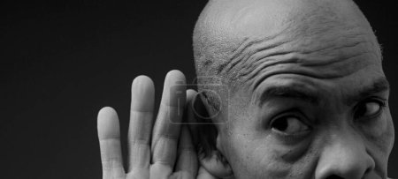 Photo for Man suffering from deafness and hearing loss - Royalty Free Image