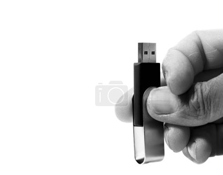 Foto de Memoria flash USB en la mano sobre fondo blanco - Imagen libre de derechos