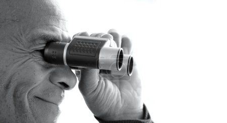 Photo for Man looking through binoculars look ahead for the future with people stock photo - Royalty Free Image
