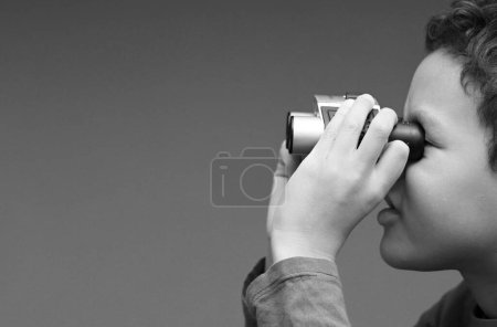 Photo for Boy looking through binoculars - Royalty Free Image