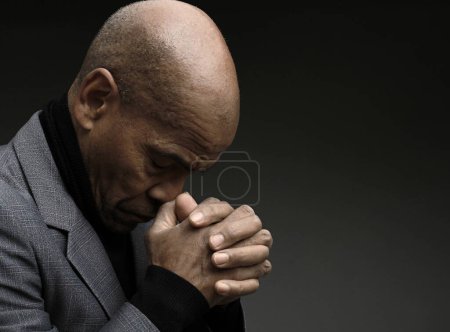 Photo for Praying to god for forgiveness Caribbean man praying - Royalty Free Image