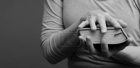 Photo for Woman praying to God and reading from bible - Royalty Free Image