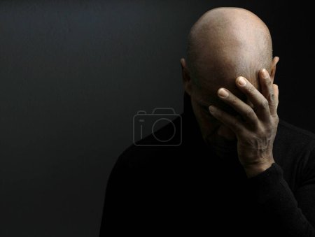 Photo for Desperated african american man against studio background - Royalty Free Image