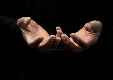 Photo for Hands of person praying on dark background, close - up view - Royalty Free Image