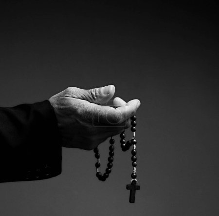 Photo for Black man praying to God on grey black background - Royalty Free Image