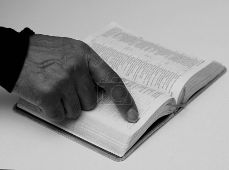 Photo for Black man praying to god with bible - Royalty Free Image