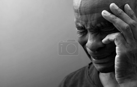 Photo for Man praying to god on grey black background - Royalty Free Image