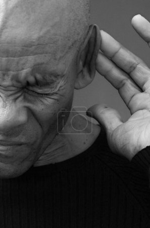 Deaf man suffering from deafness and hearing loss. 