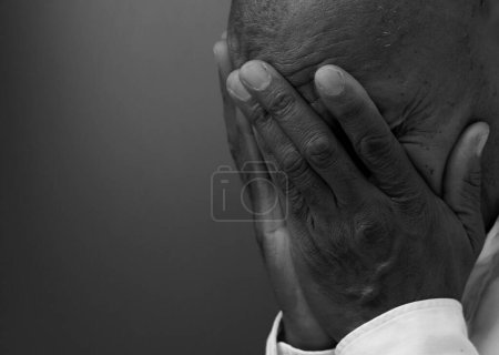 Photo for Caribbean man praying to god, black and white studio portrait - Royalty Free Image