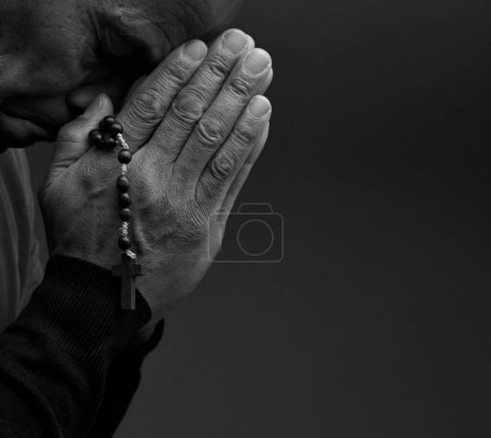 Photo for Mature man praying to god, black and white portrait - Royalty Free Image