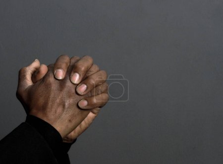 Photo for Man praying to god with hands, closeup - Royalty Free Image