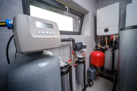 Modern electric boiler room in the house. Equipment for water heating system. Close-up of the automatic control