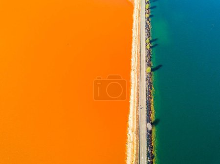 Street trough orange and blue lakes in mining region, Minas de Riotinto, Andalusia, Spain, Europe