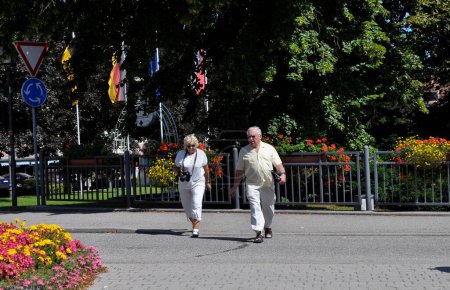 Elderly couple walking on a street