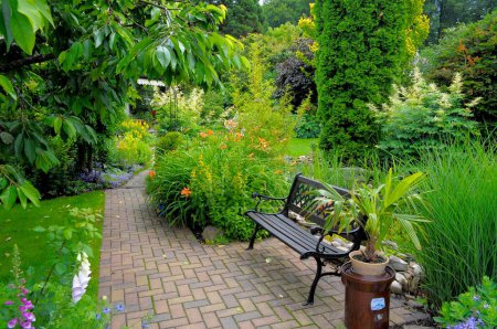 Garden path with ornamental garden, garden bench
