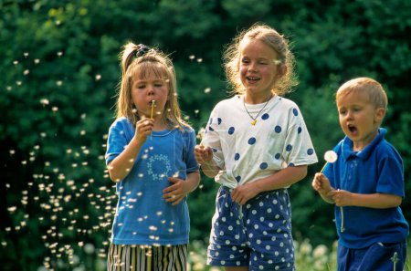 Children with dandelion flowers