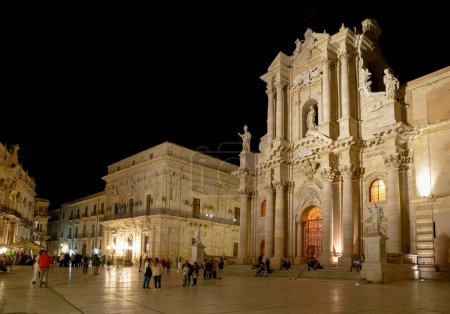Piazza Duomo, admiring the baroque cathedral of the historic center of the island of Ortigia in Syracuse, Sicily Italy.