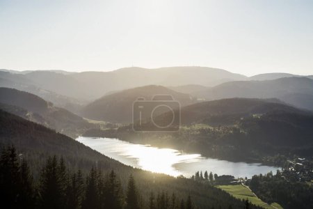View from Hochfirst to Lake Titisee and Feldberg mountain at sunset, near Neustadt,  Germany, Europe