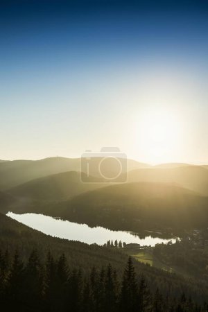 View from Hochfirst to Lake Titisee and Feldberg mountain at sunset, near Neustadt, Germany, Europe