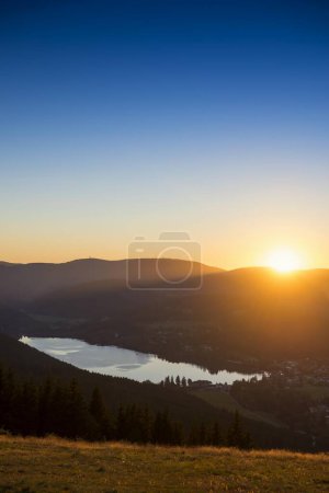 View from Hochfirst to Lake Titisee and Feldberg mountain at sunset, near Neustadt, Germany, Europe 