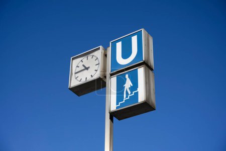 Subway sign and clock at subway station, Munich