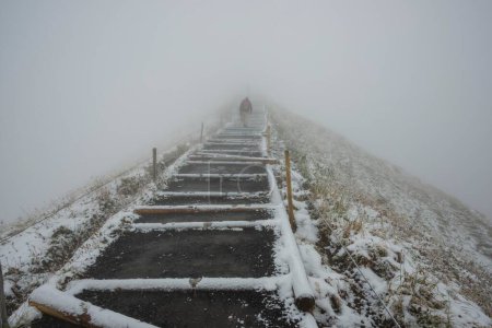 Climber in winter, thick fog, summit ridge to Fellhorn, Allgaeu Alps, Bavaria, Germany, Europe