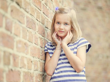 Girl, 10 years, leaning against a wall, Portrait, Germany, Europe