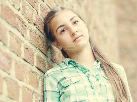 Girl, teenager, 13 years, leaning against a wall, portrait, Germany, Europe
