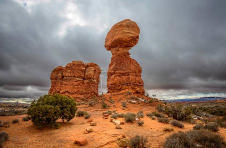 Rock formation Balanced Rock, dark cloudy sky, Arches National Park, near Moab, Utah, USA, North America