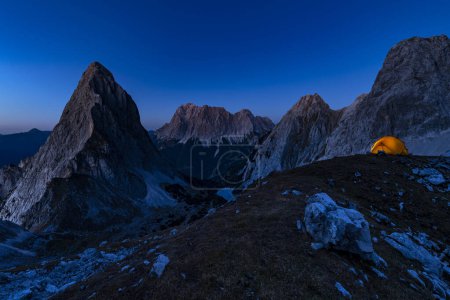 Summit of the Sonnenspitze and tent with Zugspitze in the background at blue hour, Ehrwald, Auerfern, Tyrol, Austria, Europe 
