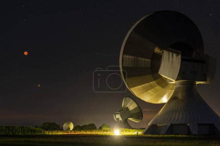 Parabolic antennas with blood moon at lunar eclipse, night shot, Raisting, Upper Bavaria, Germany, Europe