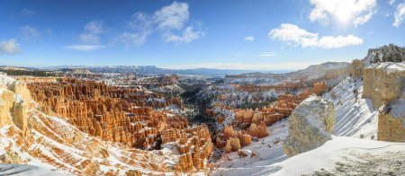 View of the amphitheatre in the morning light, snow-covered bizarre rocky landscape with Hoodoos in winter, Rim Trail, Bryce Canyon National Park, Utah, USA, North America