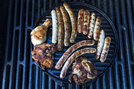 Grilled sausages and turkey meat, turkey mallets on the grill grid, Bavaria, Germany, Europe