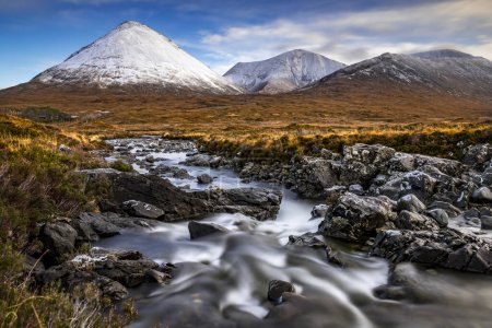 Alt Dearg Mor with snow-covered peaks of the Cullins Mountains in Highland landscape, Sligachan, Portree, Isle of Sky, Scotland, United Kingdom, Europe